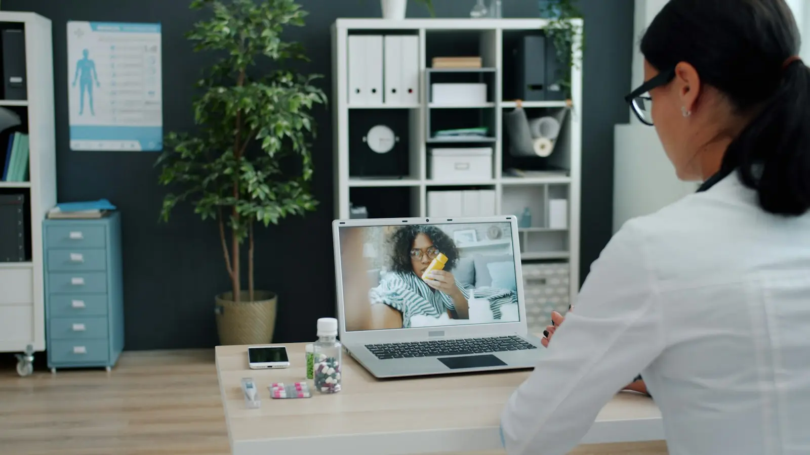 A doctor on a telehealth video visit with a patient